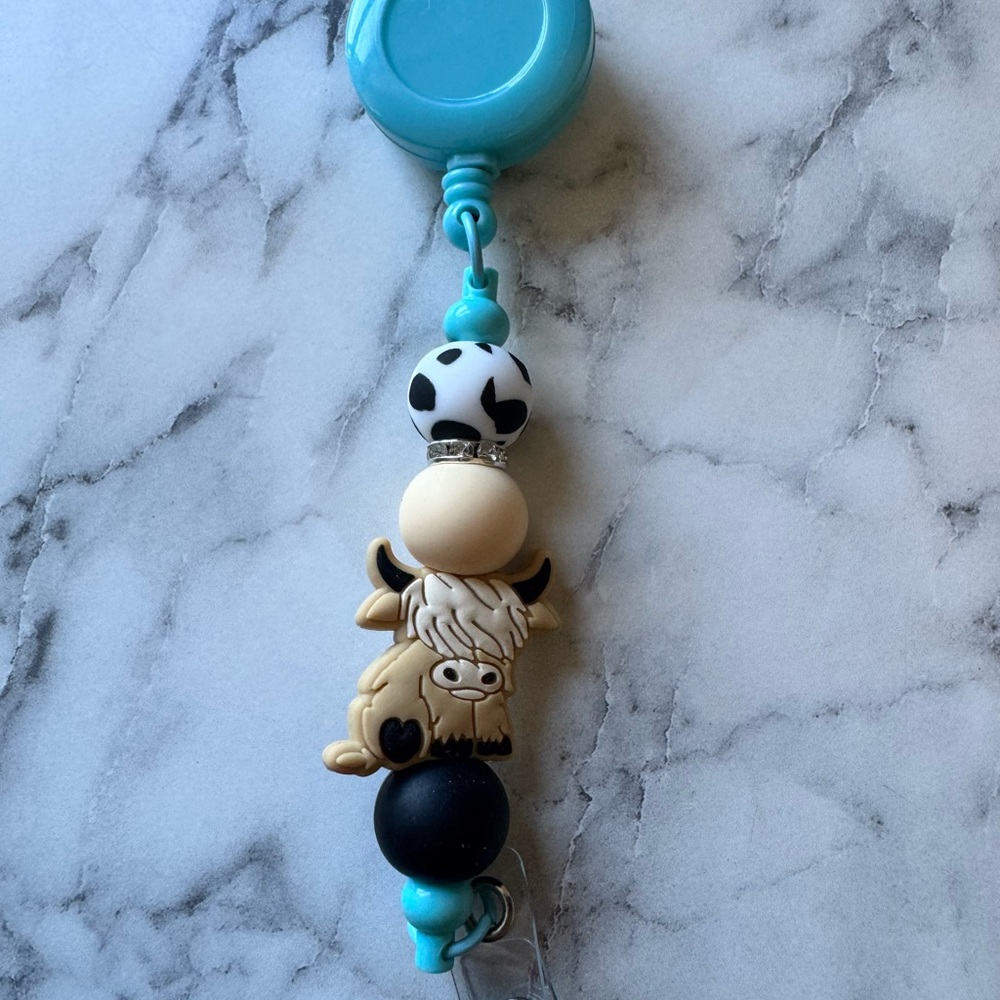 Highland cow badge reel